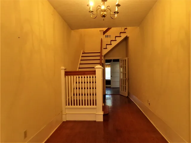 a view of entryway with wooden floor