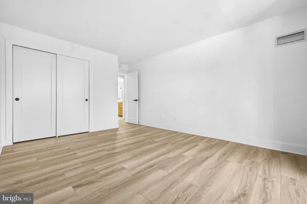 a living room with lots of furniture and gym equipment