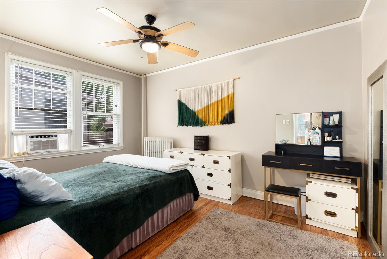 931 Emerson Street, Unit 1 Denver, CO 80218 - Photo 14 of 22 a bedroom with a bed and window