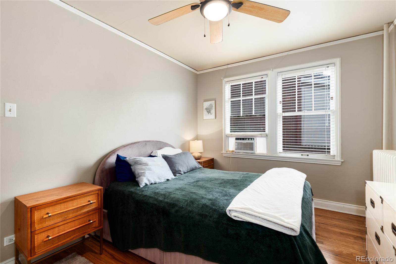 931 Emerson Street, Unit 1 Denver, CO 80218 - Photo 15 of 22 a bedroom with a bed and a window