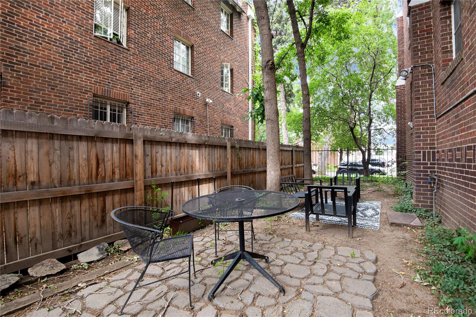 931 Emerson Street, Unit 1 Denver, CO 80218 - Photo 19 of 22 a view of a chairs and table in the patio