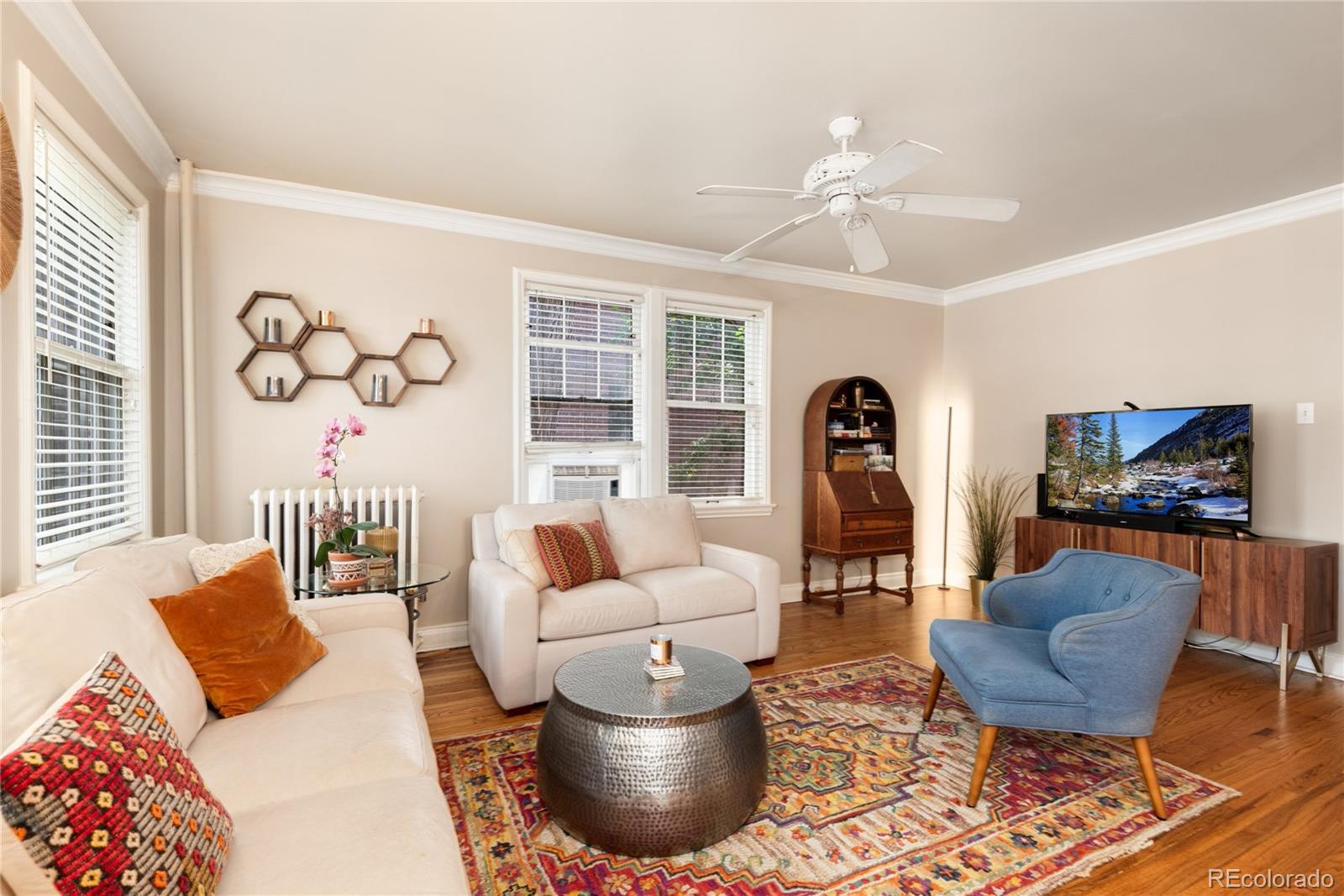 931 Emerson Street, Unit 1 Denver, CO 80218 - Photo 10 of 22 a living room with furniture and a flat screen tv