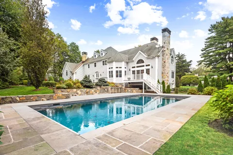 a view of a swimming pool with a garden
