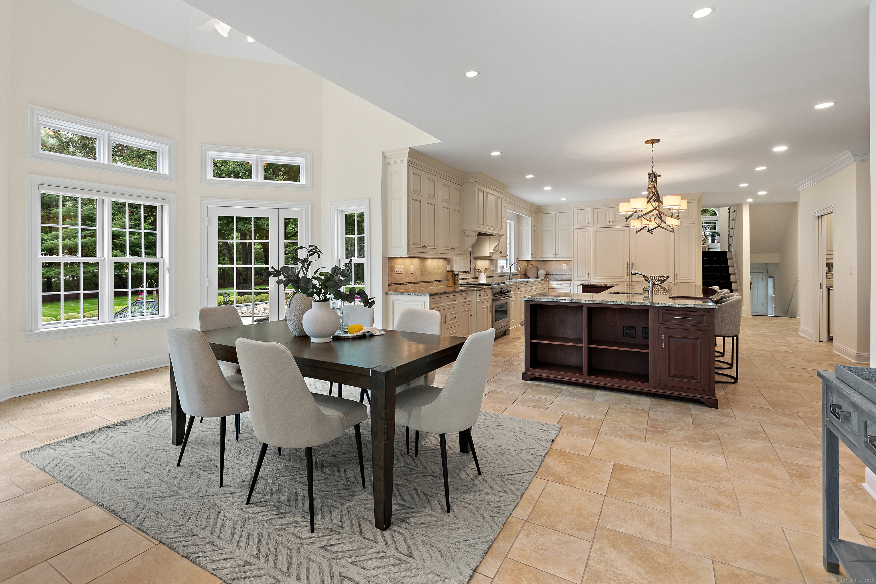 113 Skyview Lane New Canaan, CT 06840 - Photo 12 of 40 a view of a dining room with furniture and chandelier