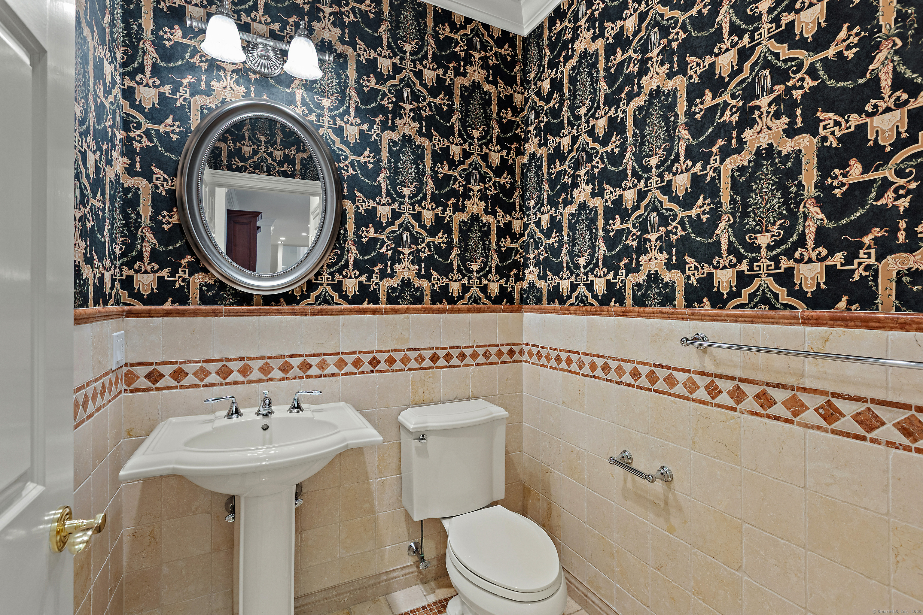 113 Skyview Lane New Canaan, CT 06840 - Photo 17 of 40 a bathroom with a toilet and a sink