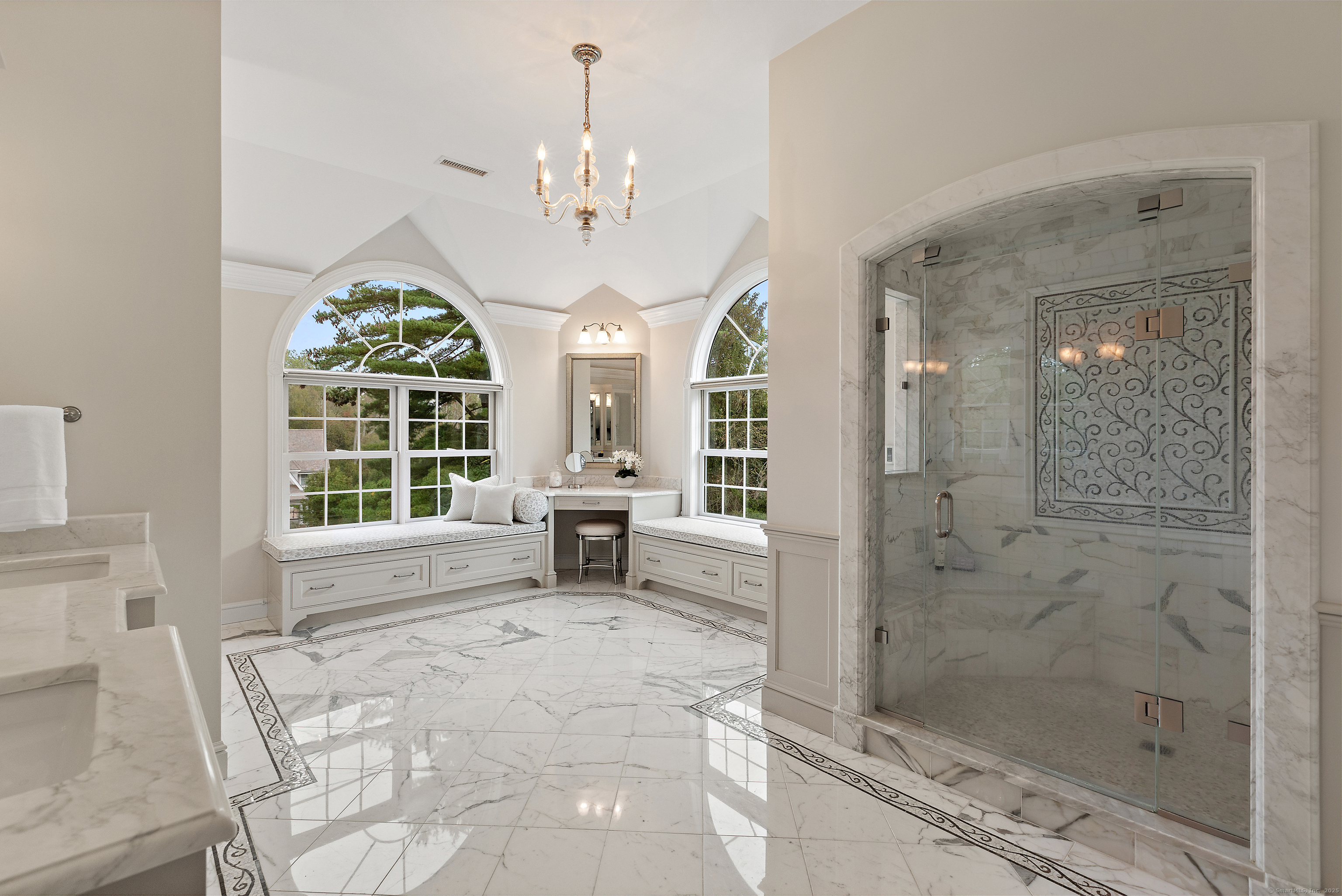 113 Skyview Lane New Canaan, CT 06840 - Photo 20 of 40 a spacious bathroom with a shower a sink and a mirror