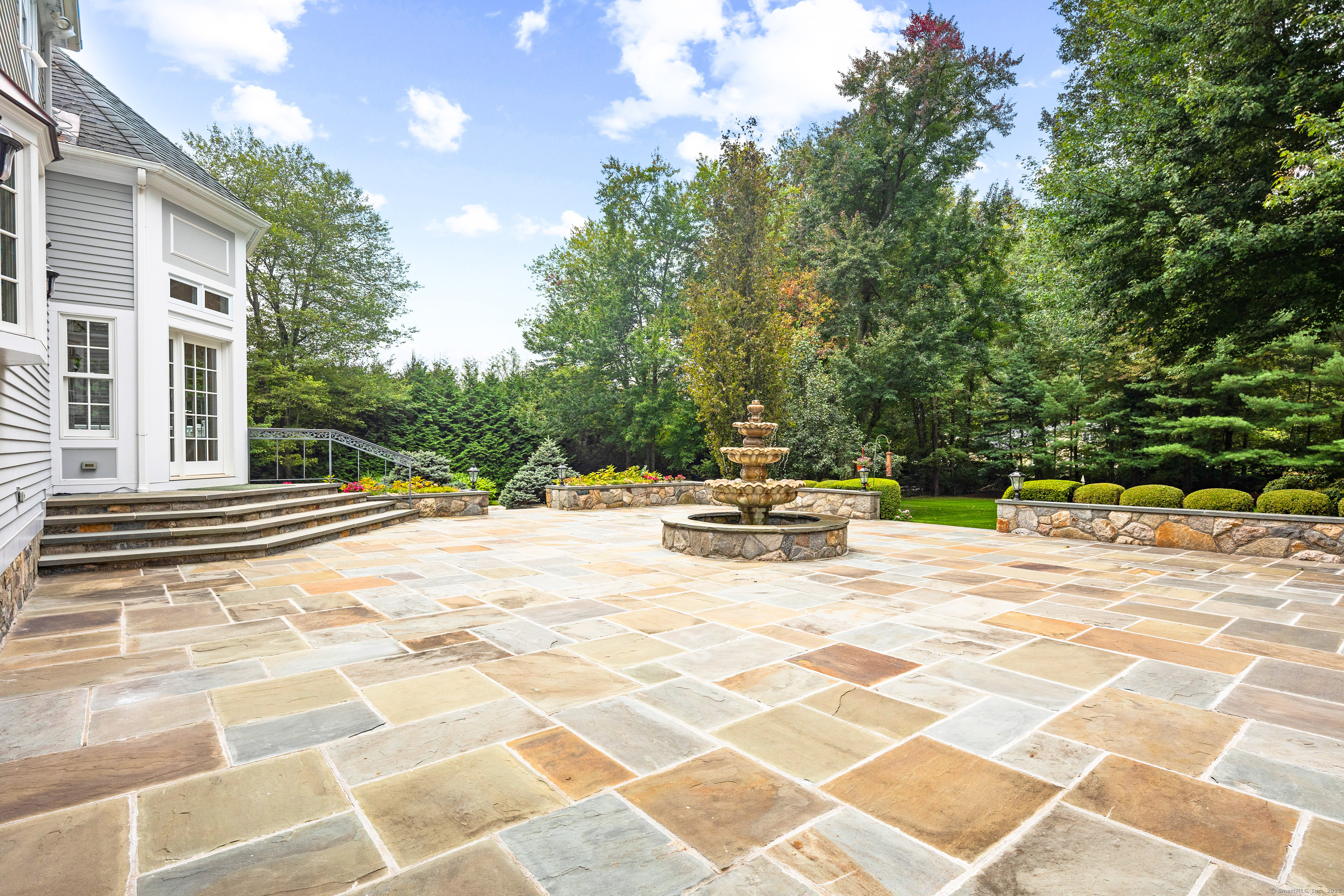 113 Skyview Lane New Canaan, CT 06840 - Photo 33 of 40 a view of a swimming pool with a patio
