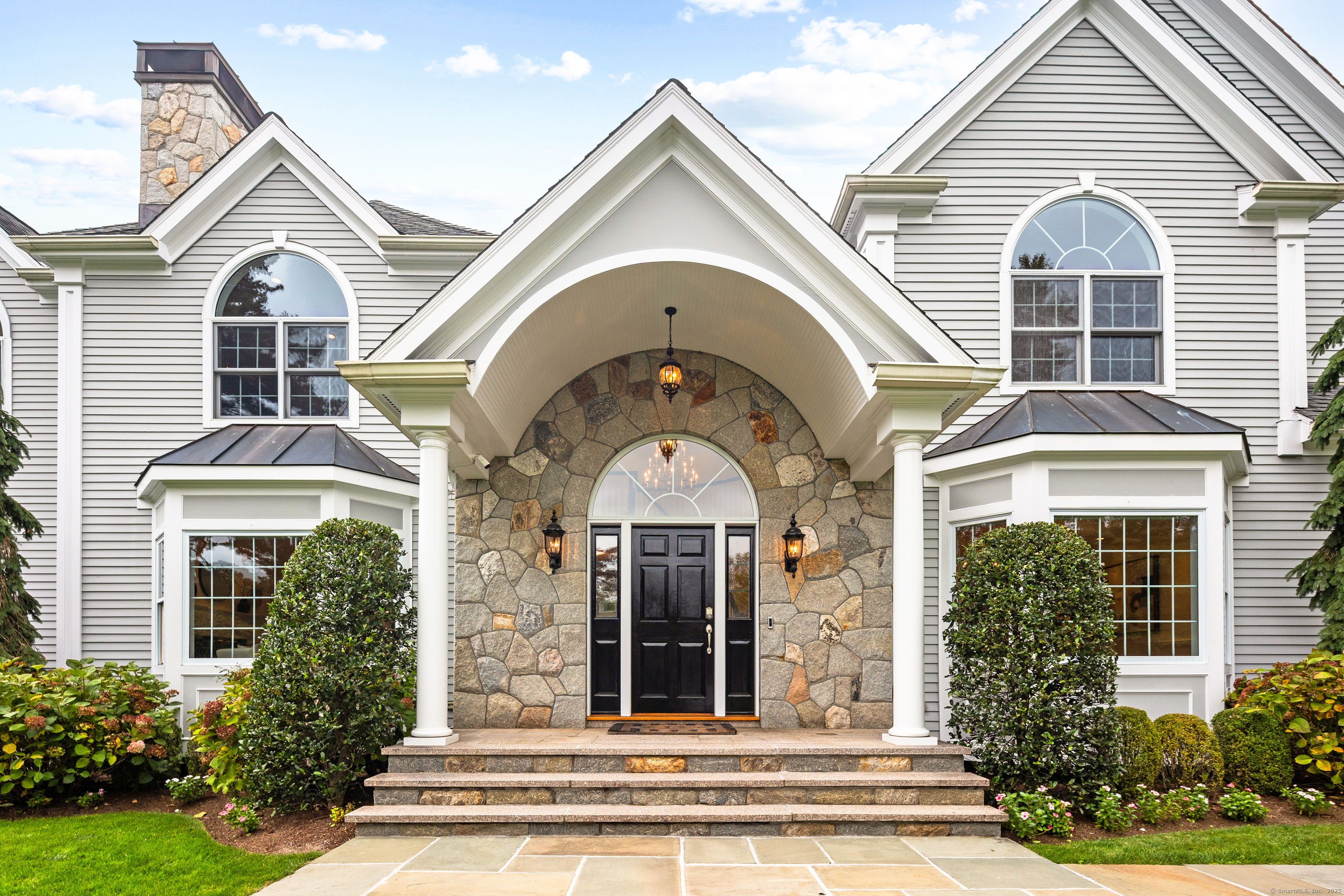 113 Skyview Lane New Canaan, CT 06840 - Photo 4 of 40 a view of a house with a porch
