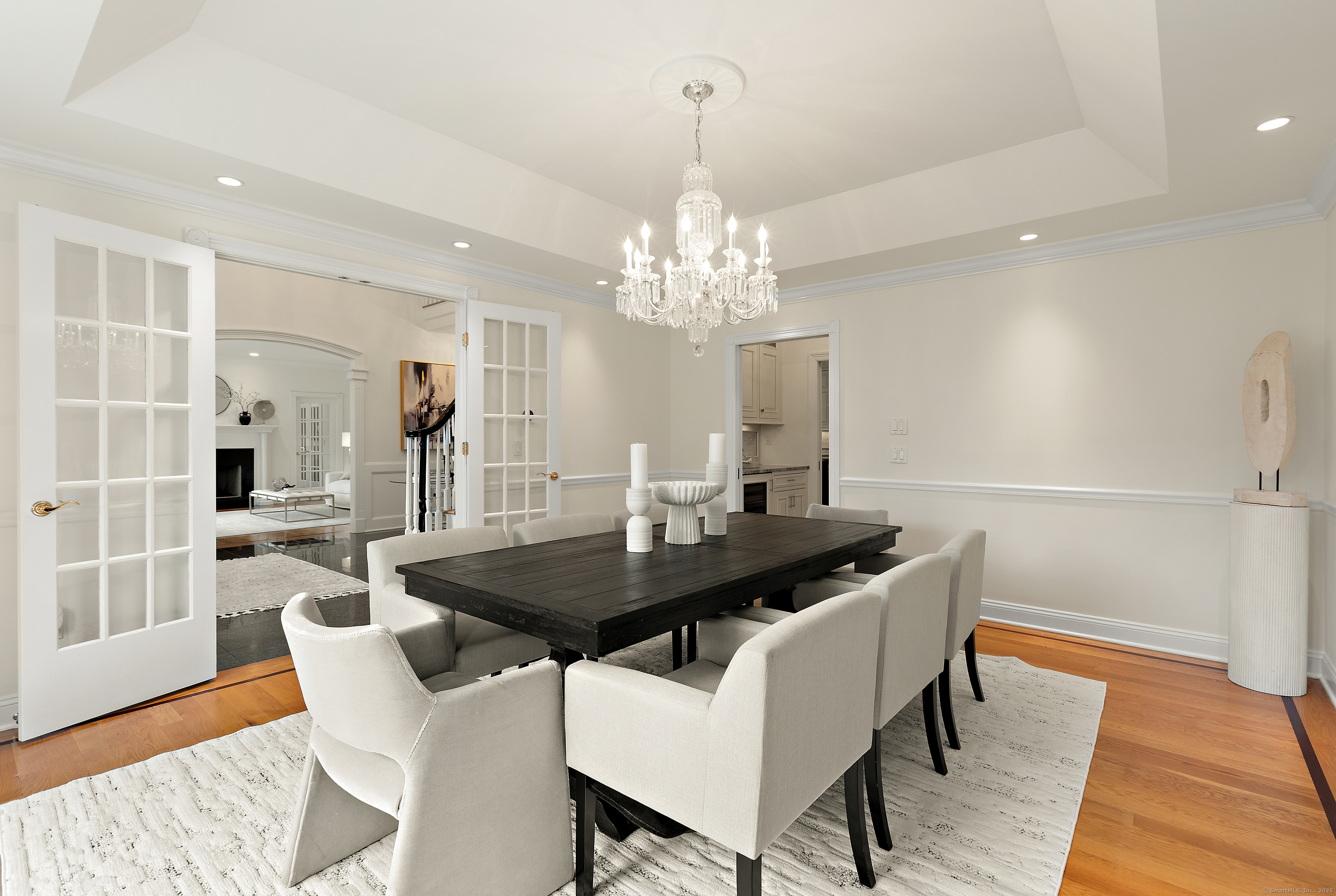 113 Skyview Lane New Canaan, CT 06840 - Photo 8 of 40 a view of a dining room with furniture and wooden floor