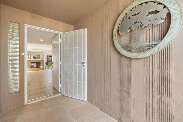 an entryway with wooden floor