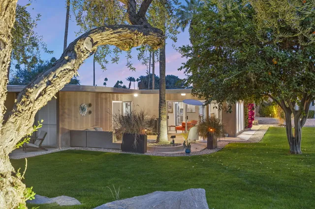 a view of a park with large trees