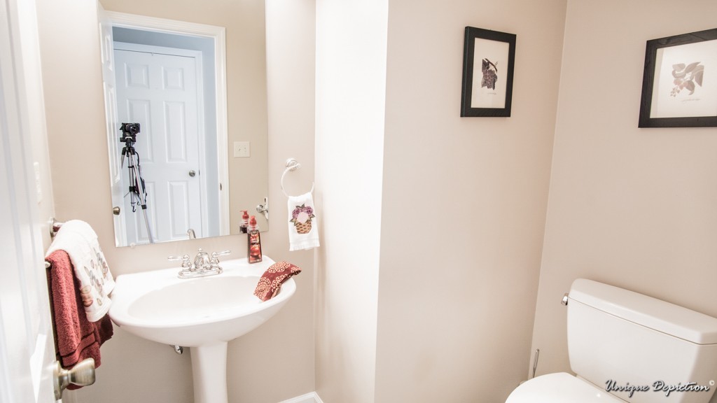 10 Evergreen Way, Unit 10 Peabody, MA 01960 - Photo 11 of 24 a bathroom with a sink toilet and a mirror
