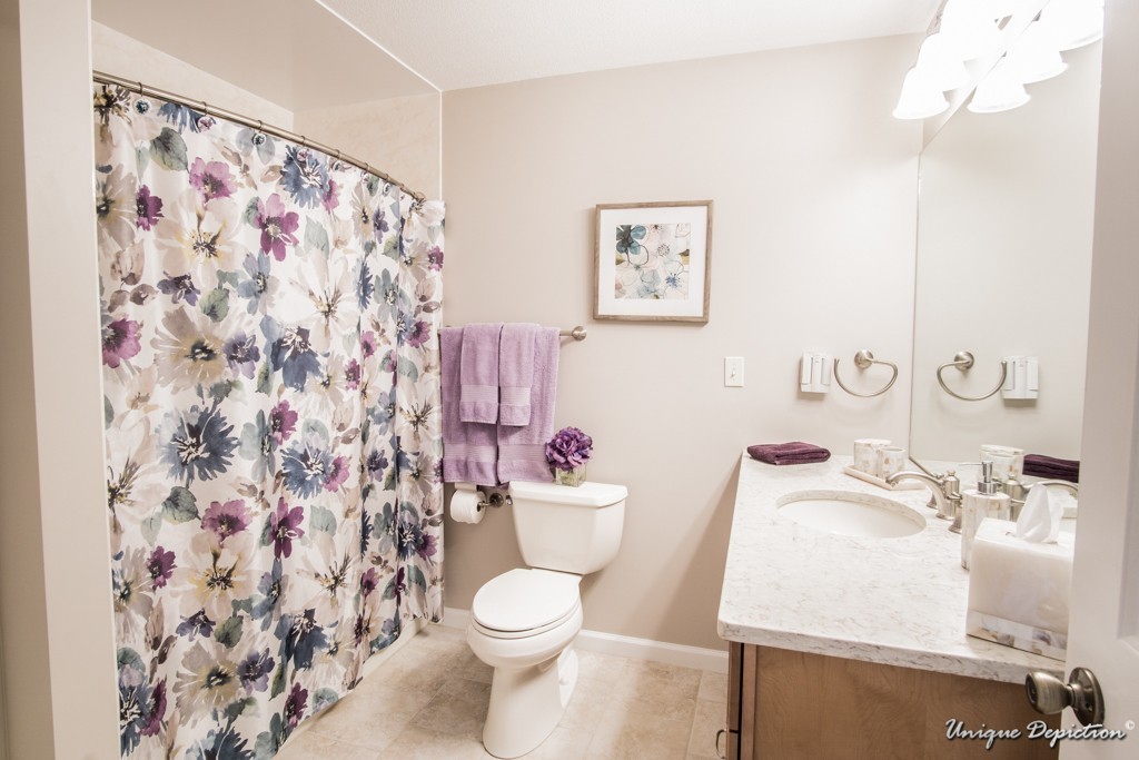 10 Evergreen Way, Unit 10 Peabody, MA 01960 - Photo 16 of 24 a white toilet sitting next to a bathroom sink