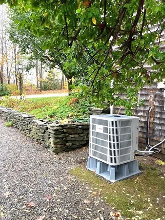 a view of a yard with wooden fence