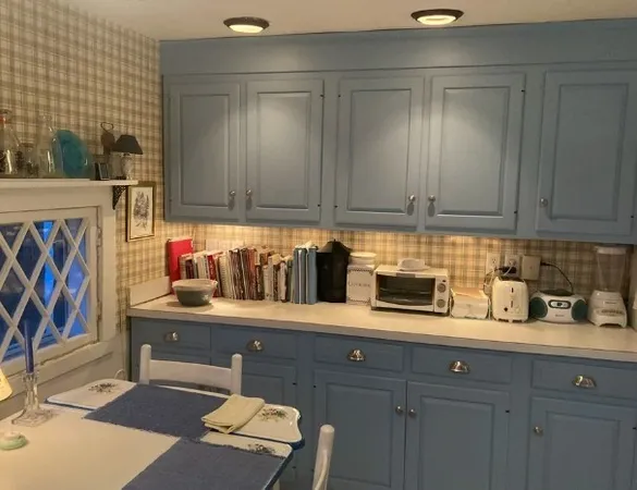 a kitchen with stainless steel appliances granite countertop a sink and cabinets
