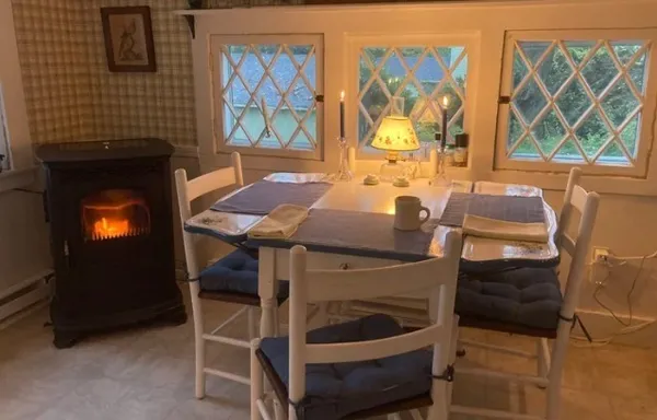 a dining room with furniture and window