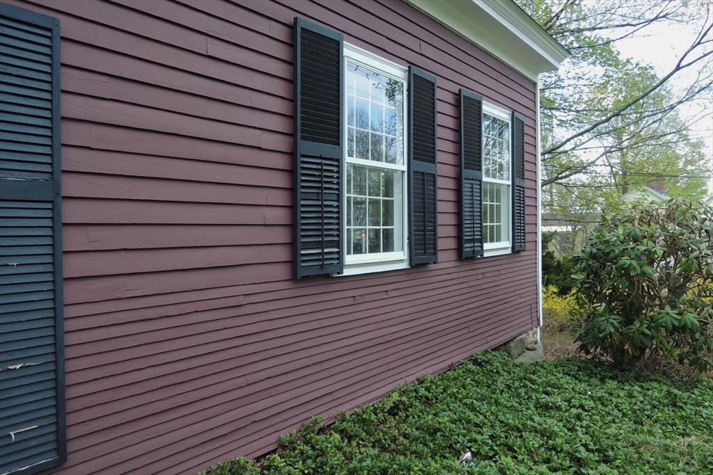 17 South Main Street Petersham, MA 01366 - Photo 5 of 24 a view of brick house with a large window and flower plants