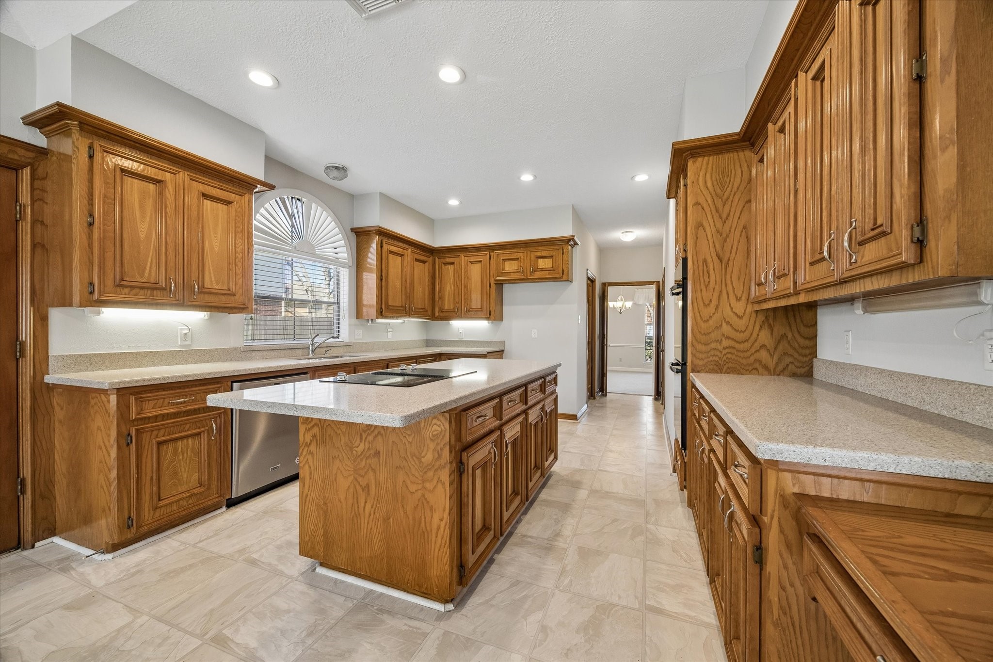 1707 Rambling Stone Drive Richmond, TX 77406 - Photo 13 of 42 CORIAN COUNTERTOPS AND BACKSPLASH PROVIDE A CLEAN, SEAMLESS LOOK WITH DURABLE FINISHES.