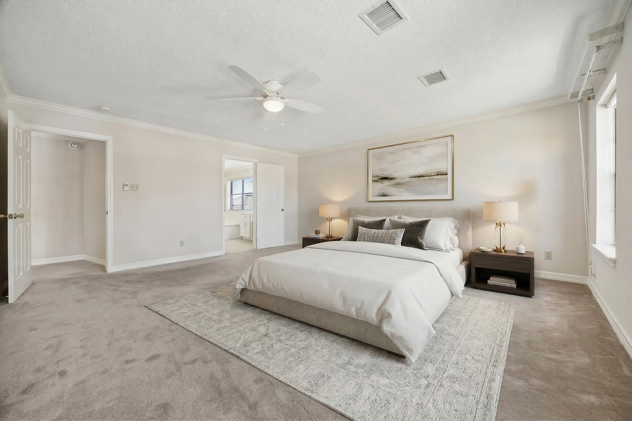 1707 Rambling Stone Drive Richmond, TX 77406 - Photo 19 of 42 a large bedroom with a bed and a chandelier