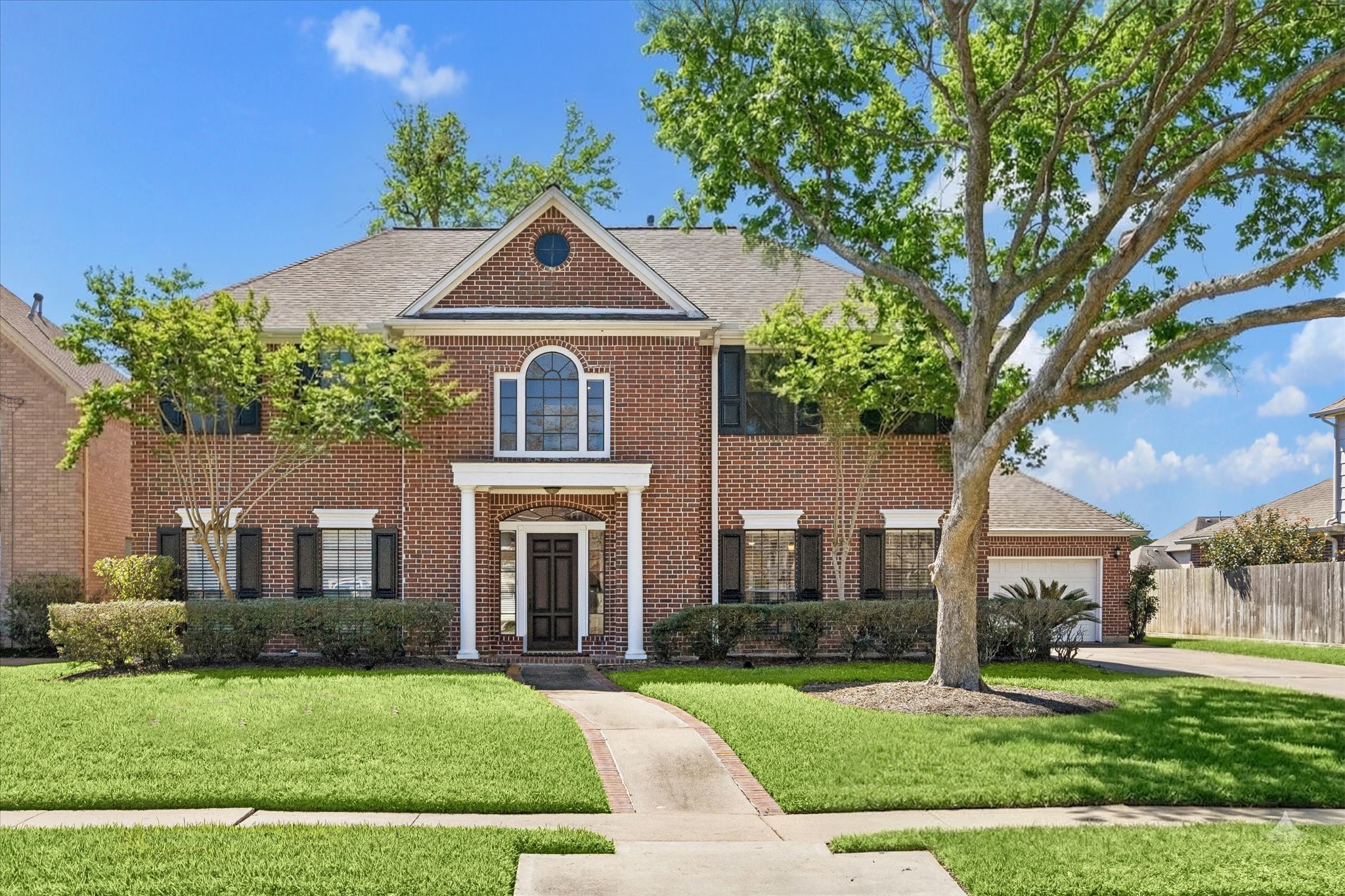 1707 Rambling Stone Drive Richmond, TX 77406 - Photo 2 of 42 a front view of a house with a yard
