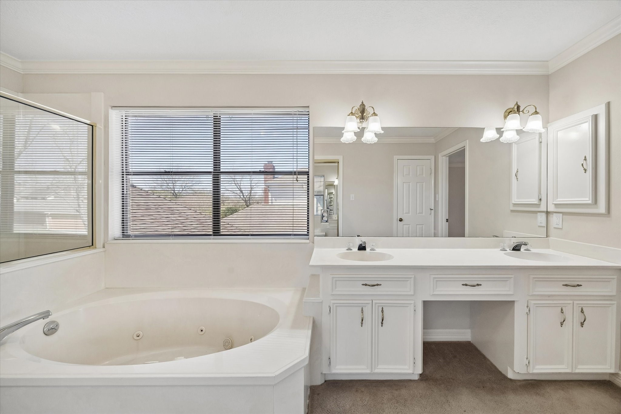 1707 Rambling Stone Drive Richmond, TX 77406 - Photo 26 of 42 a bathroom with a bathtub a sink and a window