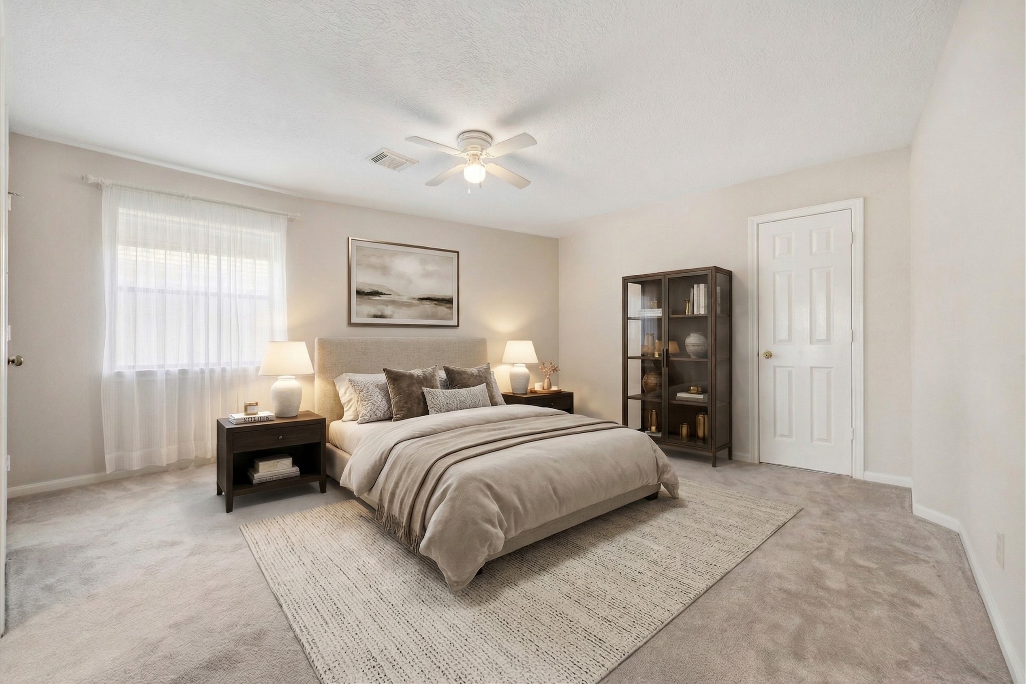 1707 Rambling Stone Drive Richmond, TX 77406 - Photo 29 of 42 a bedroom with a large bed and a chandelier