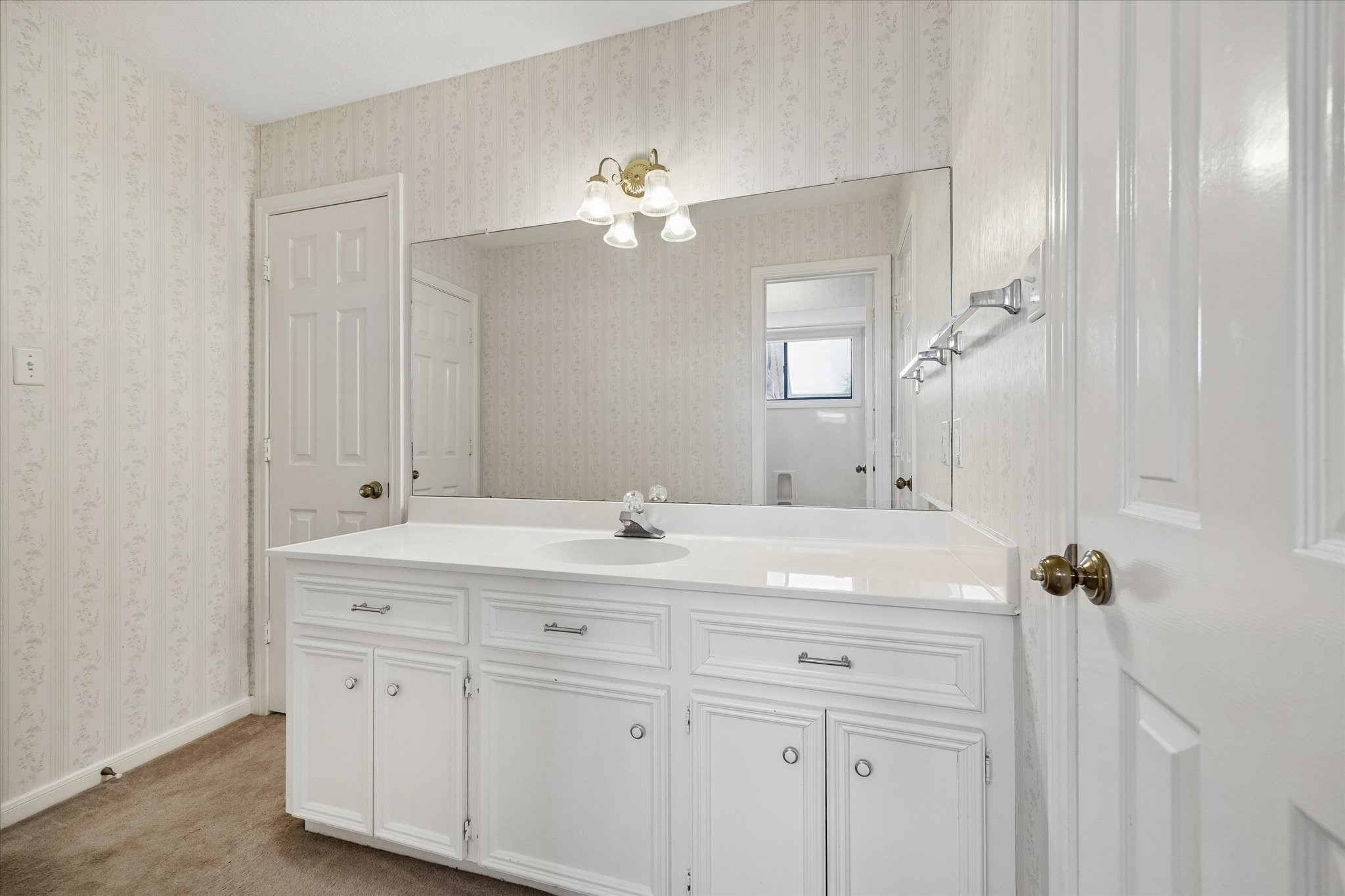 1707 Rambling Stone Drive Richmond, TX 77406 - Photo 30 of 42 a bathroom with a double vanity sink a mirror and a bathtub