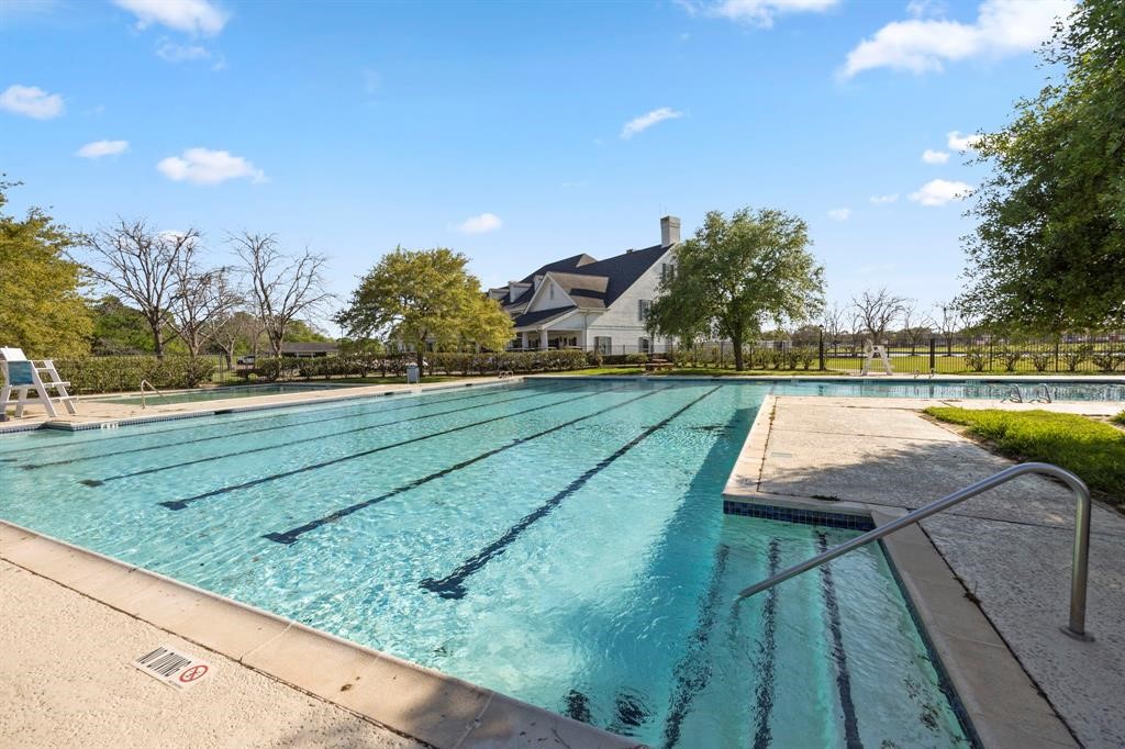 1707 Rambling Stone Drive Richmond, TX 77406 - Photo 35 of 42 a view of swimming pool with a yard and sitting area