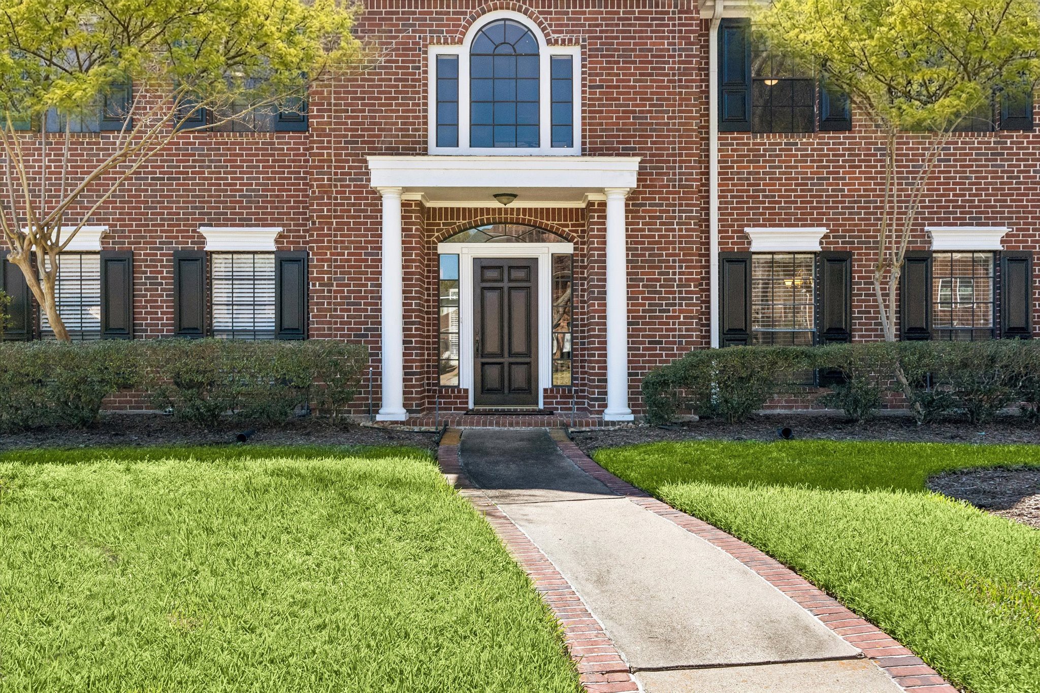 1707 Rambling Stone Drive Richmond, TX 77406 - Photo 5 of 42 a front view of a house with garden