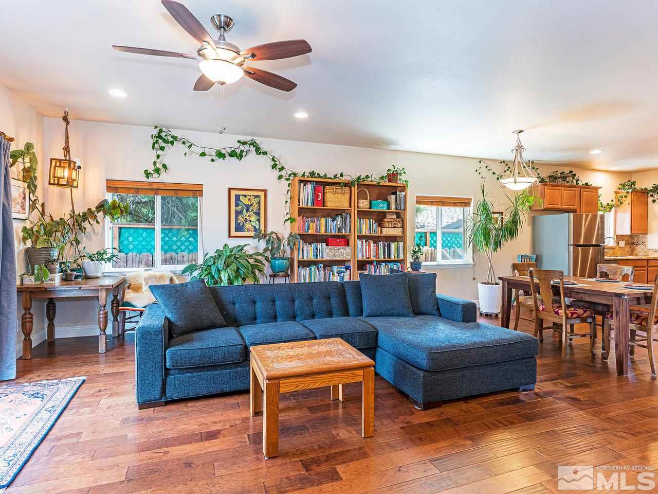 760 Barry M Circle Reno, NV 89503 - Photo 7 of 24 a living room with furniture a ceiling fan and a rug