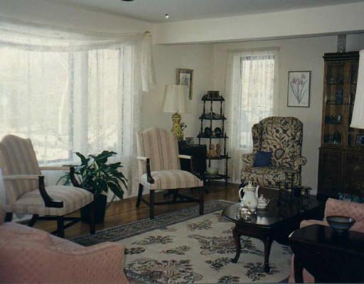 176 Taylor Road New Milford, CT 06776 - Photo 1 of 1 a living room with furniture and a potted plant