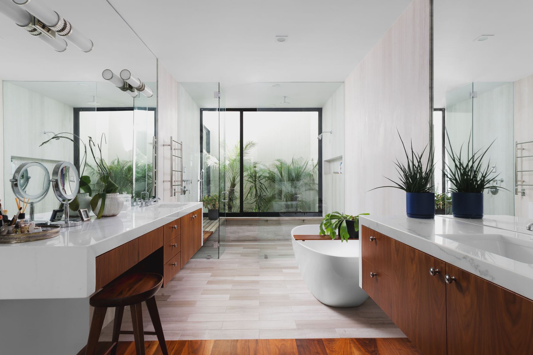 303 Farley Trail Austin, TX 78746 - Photo 11 of 18 a large white kitchen with a large window and potted plant