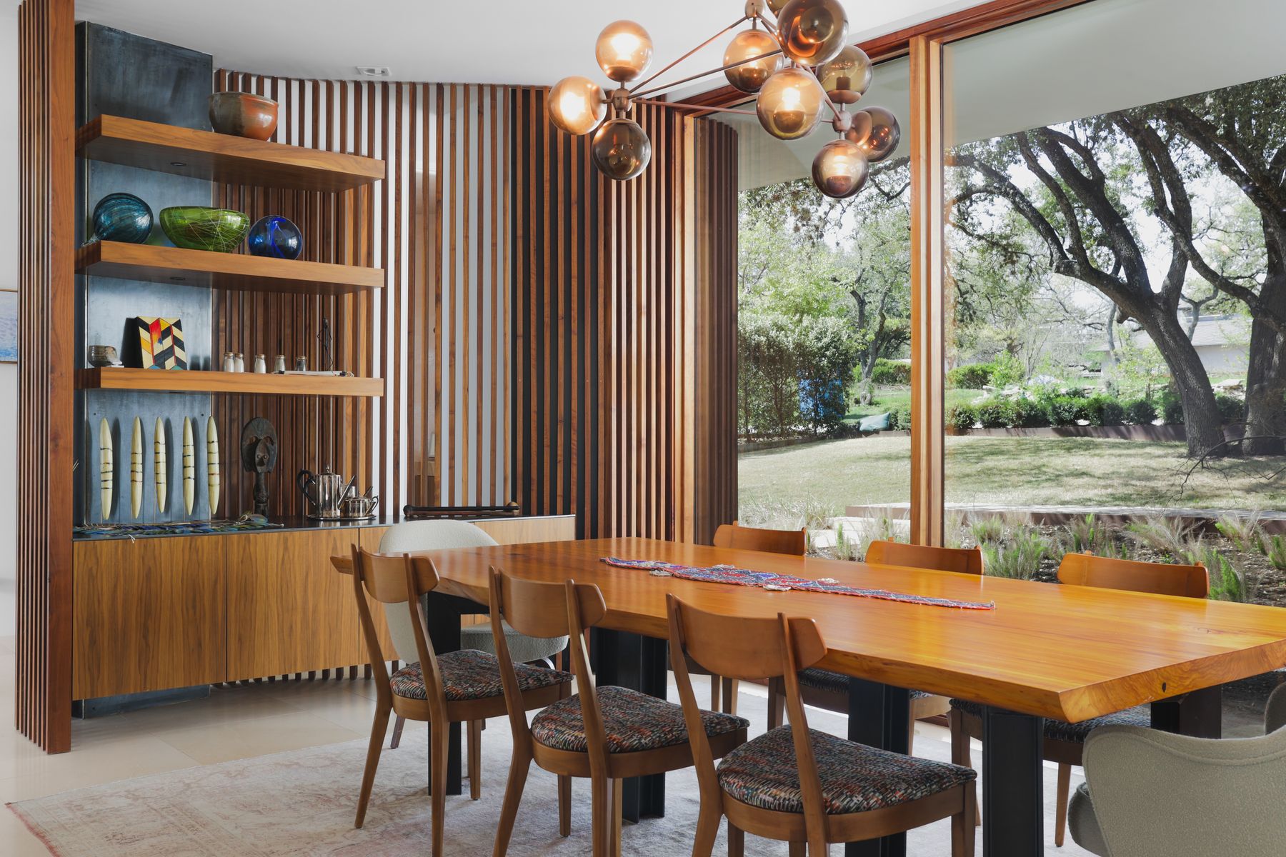 303 Farley Trail Austin, TX 78746 - Photo 5 of 18 a dining room with furniture and a floor to ceiling window