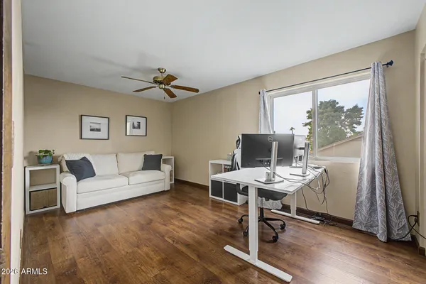 a living room with furniture a window and a table