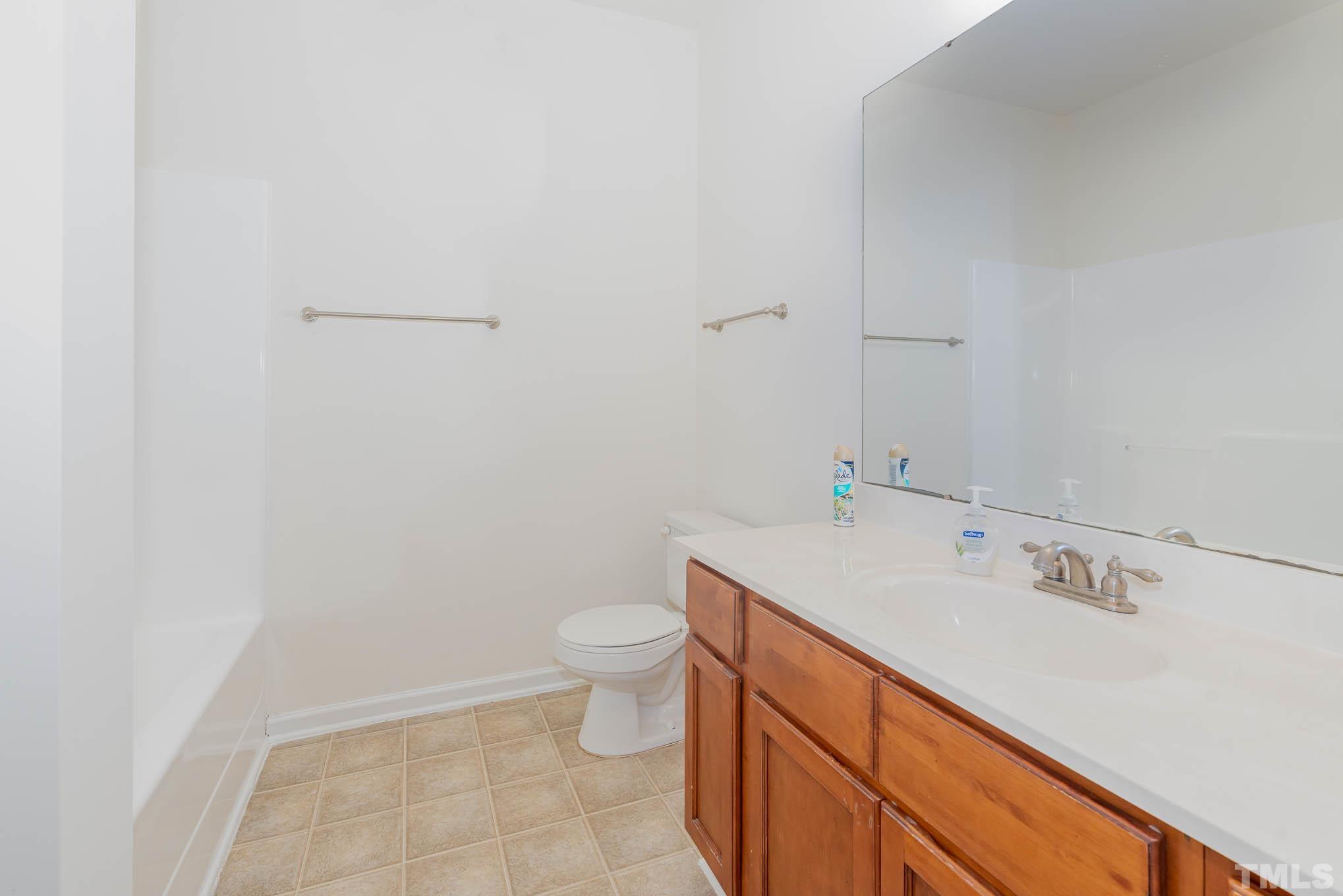 2631 Oldgate Drive, Unit 103 Raleigh, NC 27604 - Photo 11 of 15 a view of bathroom with a sink and toilet