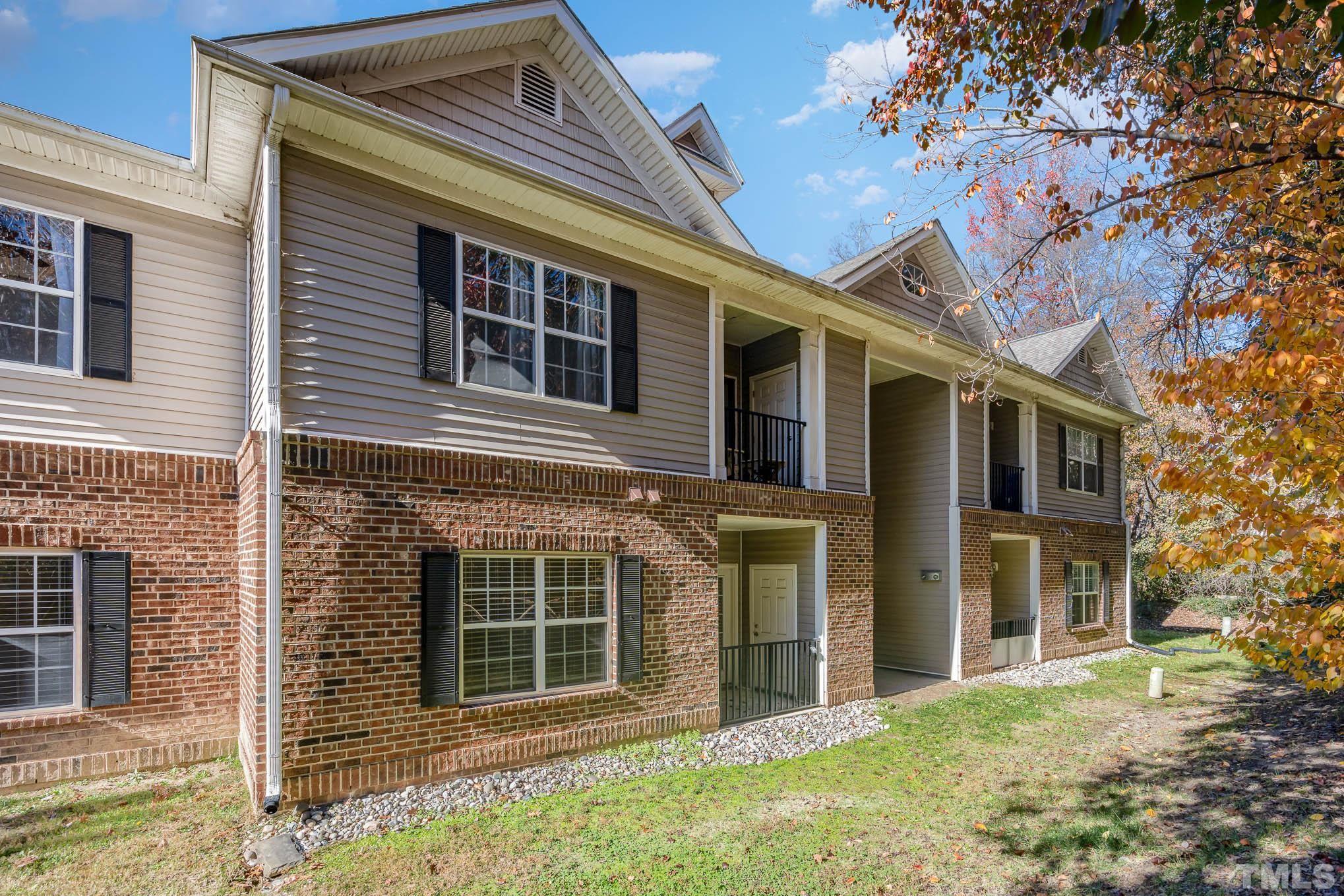 2631 Oldgate Drive, Unit 103 Raleigh, NC 27604 - Photo 14 of 15 a front view of a house with a yard
