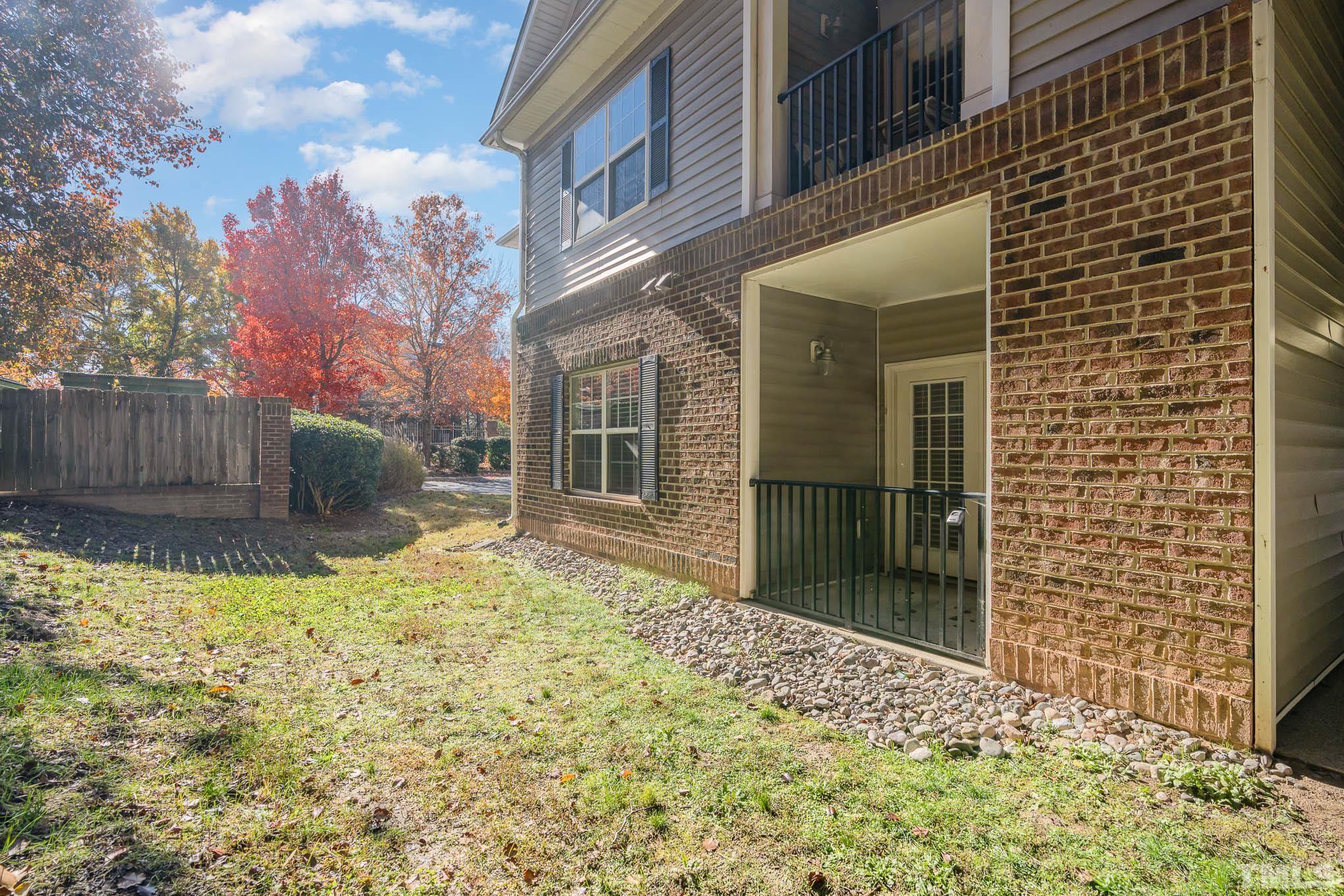 2631 Oldgate Drive, Unit 103 Raleigh, NC 27604 - Photo 15 of 15 a view of a house with a wooden fence
