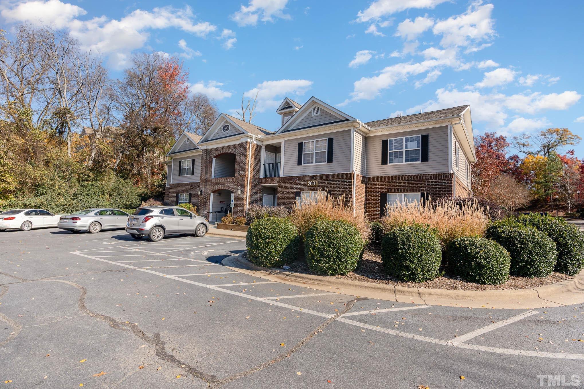 2631 Oldgate Drive, Unit 103 Raleigh, NC 27604 - Photo 2 of 15 a front view of a house with a garden