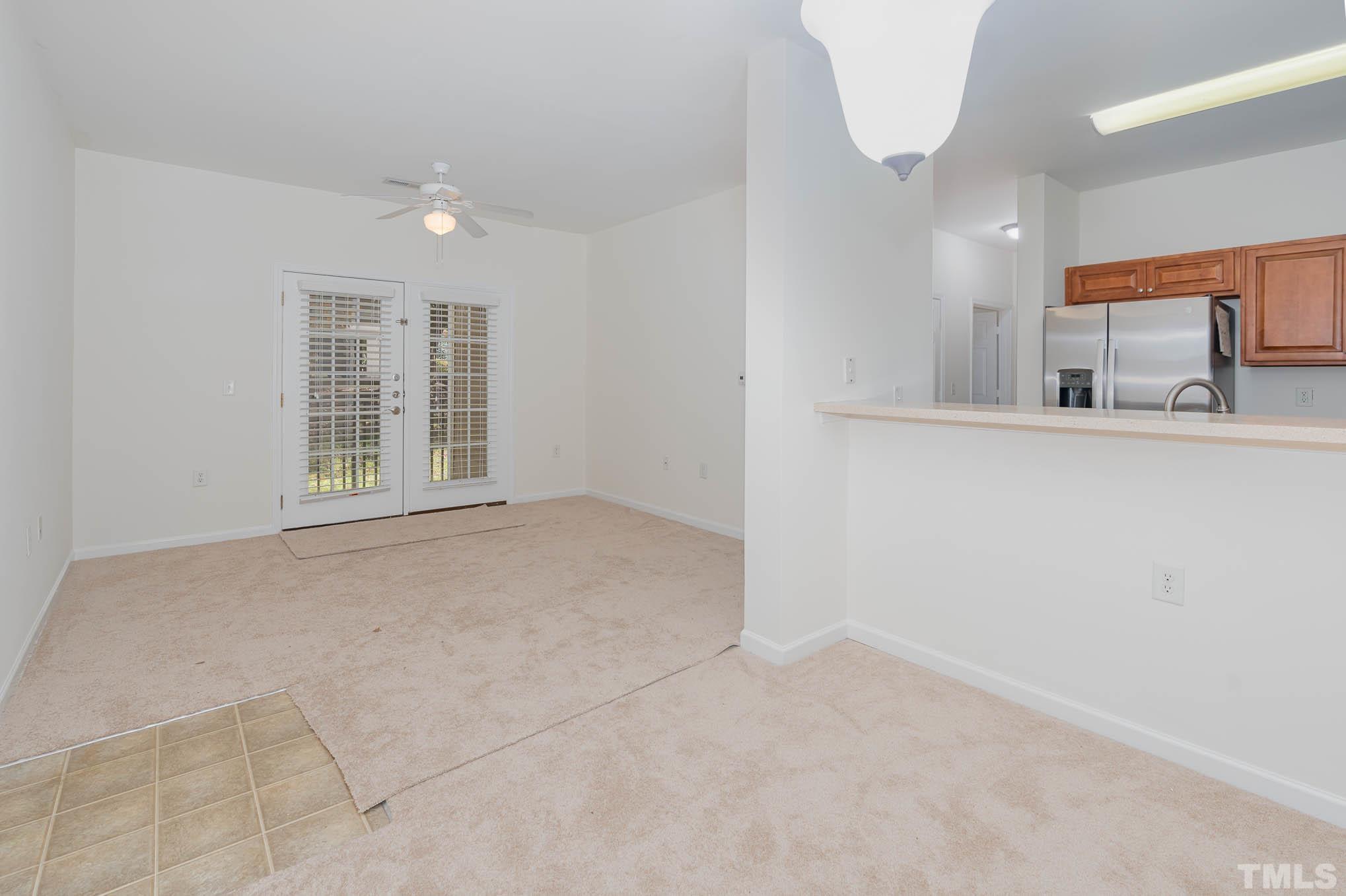 2631 Oldgate Drive, Unit 103 Raleigh, NC 27604 - Photo 5 of 15 an empty room with windows and sink