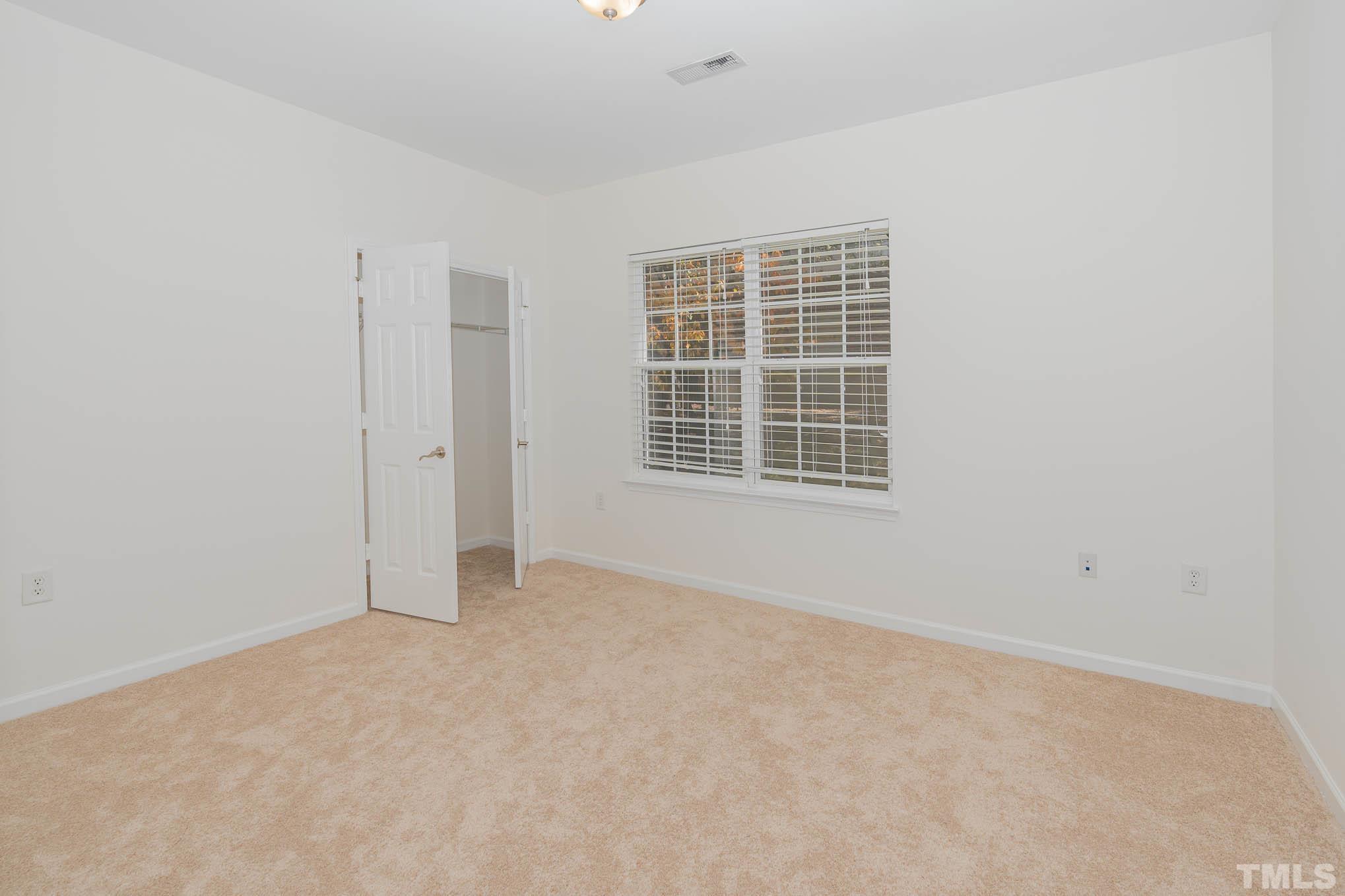 2631 Oldgate Drive, Unit 103 Raleigh, NC 27604 - Photo 7 of 15 a view of an empty room with a window