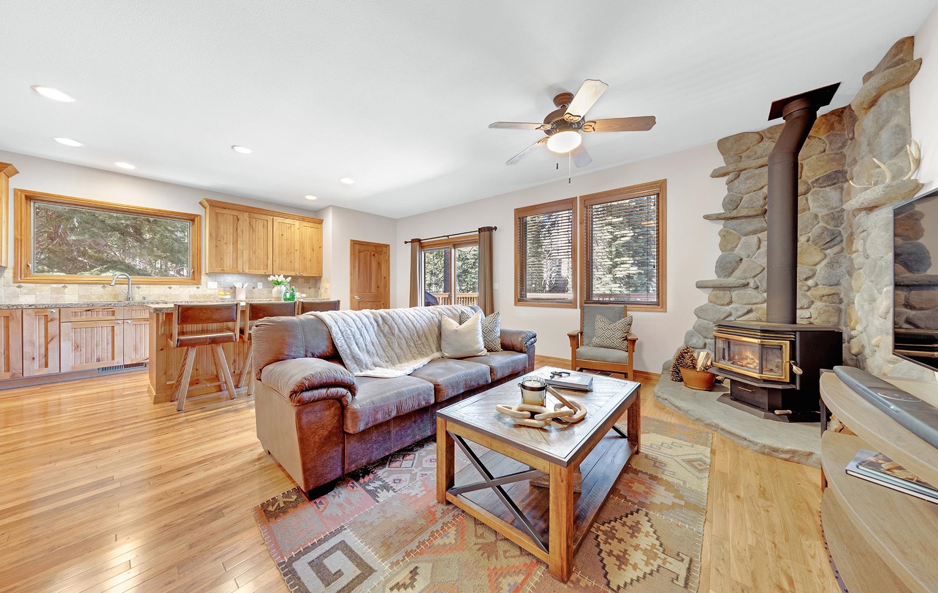 627 Deep Forest Road Lake Almanor, CA 96137 - Photo 7 of 29 a living room with furniture and a large window