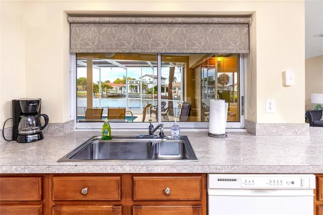 a kitchen with stainless steel appliances a stove and a microwave