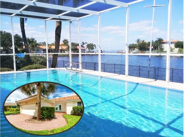 a swimming pool with outdoor seating and yard