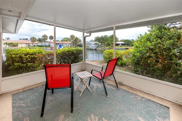 a bedroom with a bed and lamp on dresser