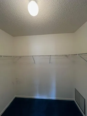 a view of a room with racks on the wall