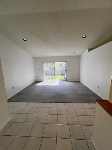 a large bedroom with a bed