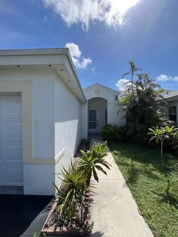 a house with garden in front of it