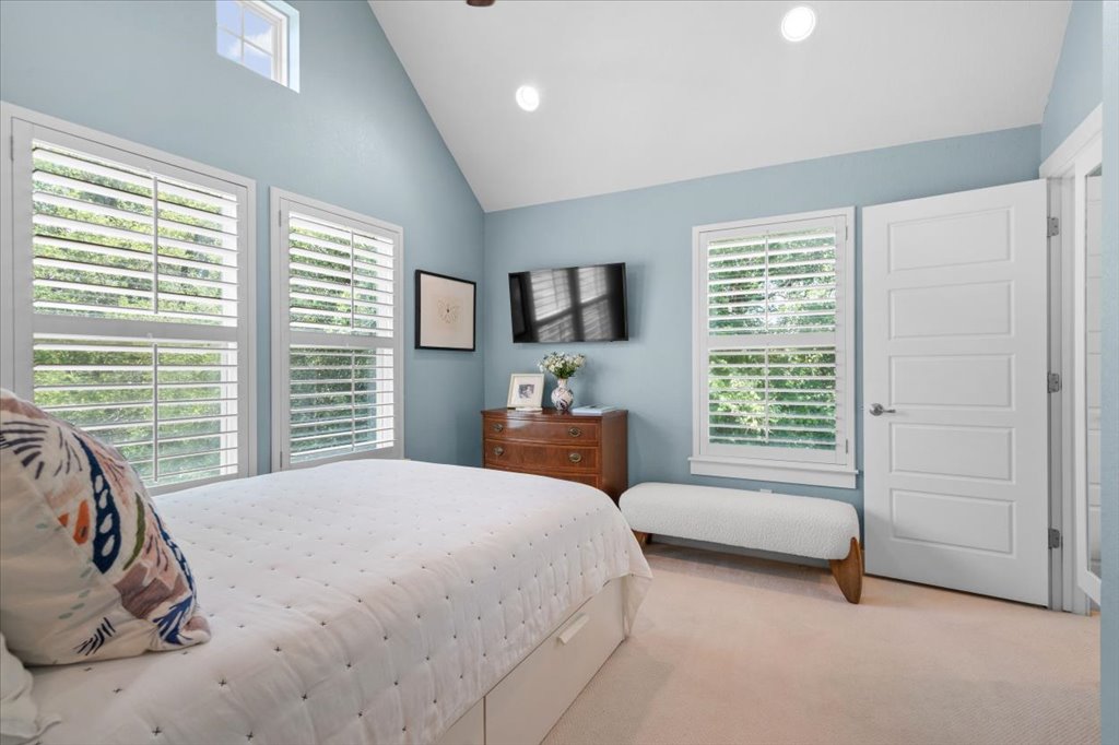 12200 Tawny Farms Road, Unit 139 Austin, TX 78748 - Photo 21 of 30 Turning around in the second bedroom, you can appreciate the architectural details that make this home feel custom, like the high transom window near the peak of the ceiling. It’s incredibly bright, airy, and gives your guests plenty of room to stretch out and unwind.