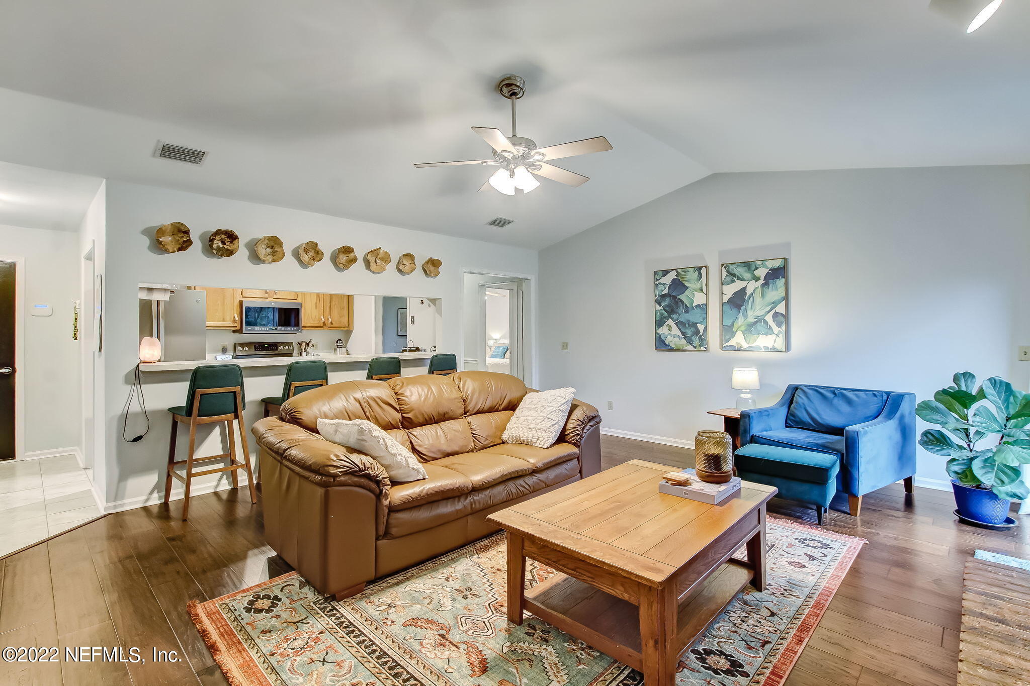 1618 Panther Ridge Court Jacksonville, FL 32225 - Photo 11 of 46 a living room with furniture and a chandelier