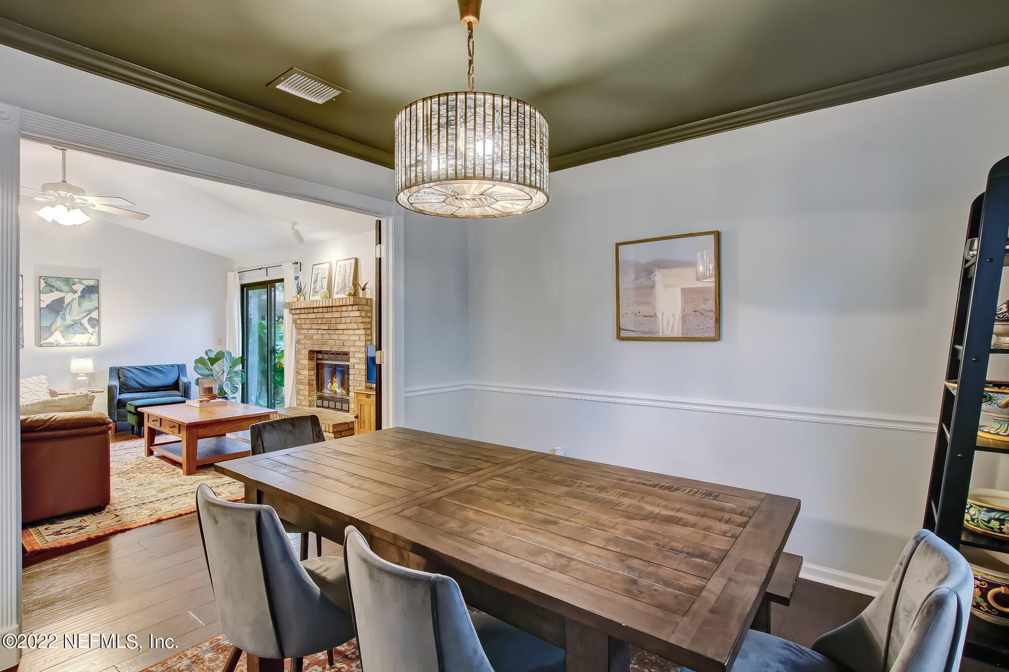 1618 Panther Ridge Court Jacksonville, FL 32225 - Photo 14 of 46 a view of a dining room with furniture wooden floor and chandelier